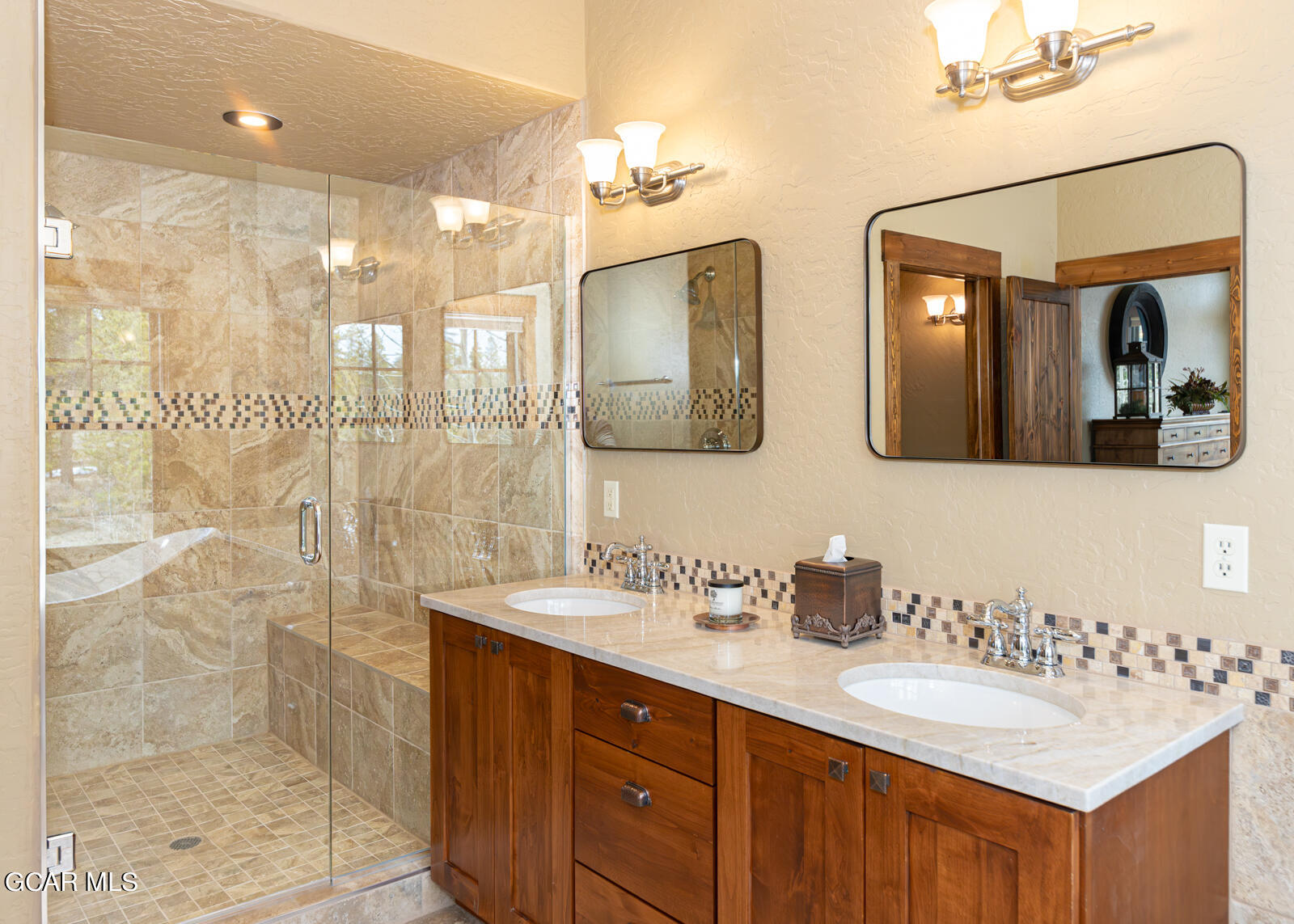 40 Golf Course Circle Tabernash, CO 80478 - Photo 11 of 57 a bathroom with double vanity sinks and a shower