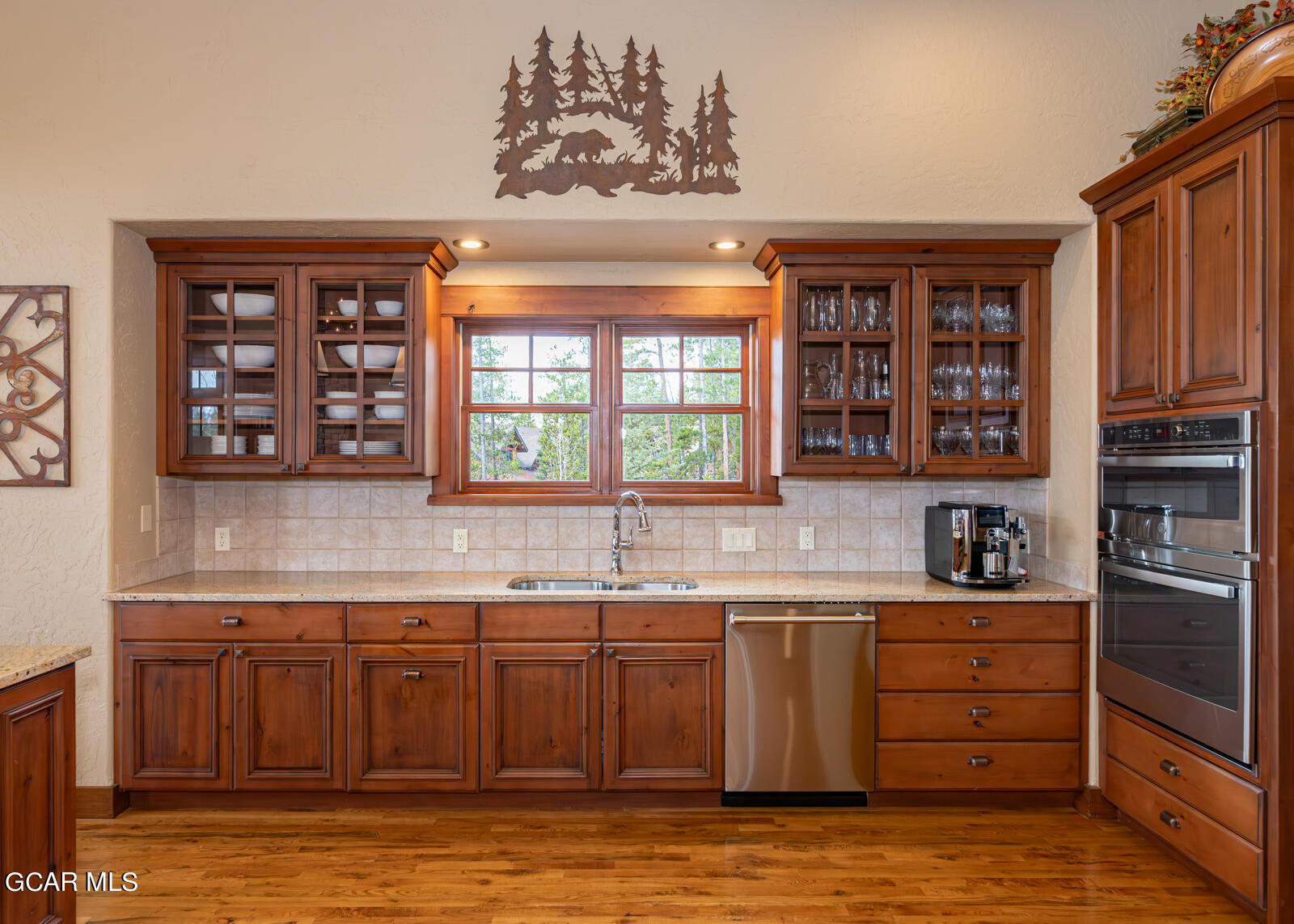 40 Golf Course Circle Tabernash, CO 80478 - Photo 16 of 57 a kitchen with stainless steel appliances granite countertop a sink and cabinets