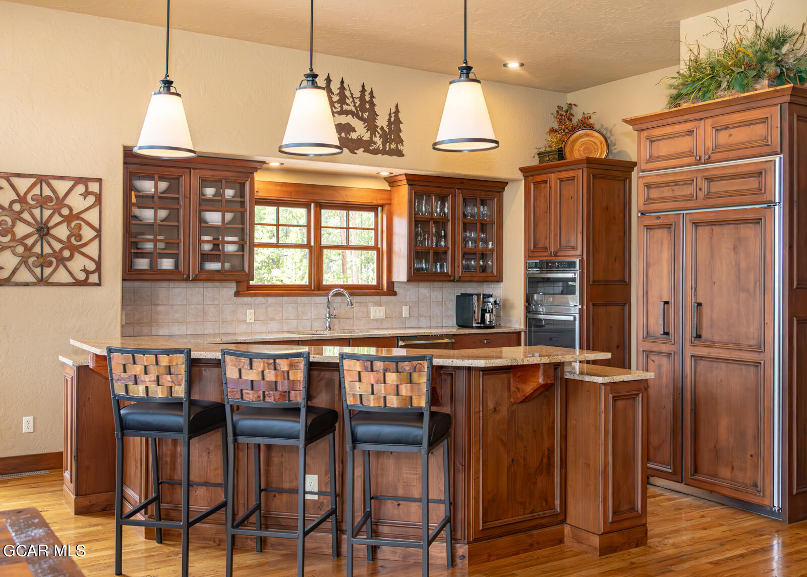 40 Golf Course Circle Tabernash, CO 80478 - Photo 20 of 57 a kitchen with granite countertop a stove a sink and a refrigerator