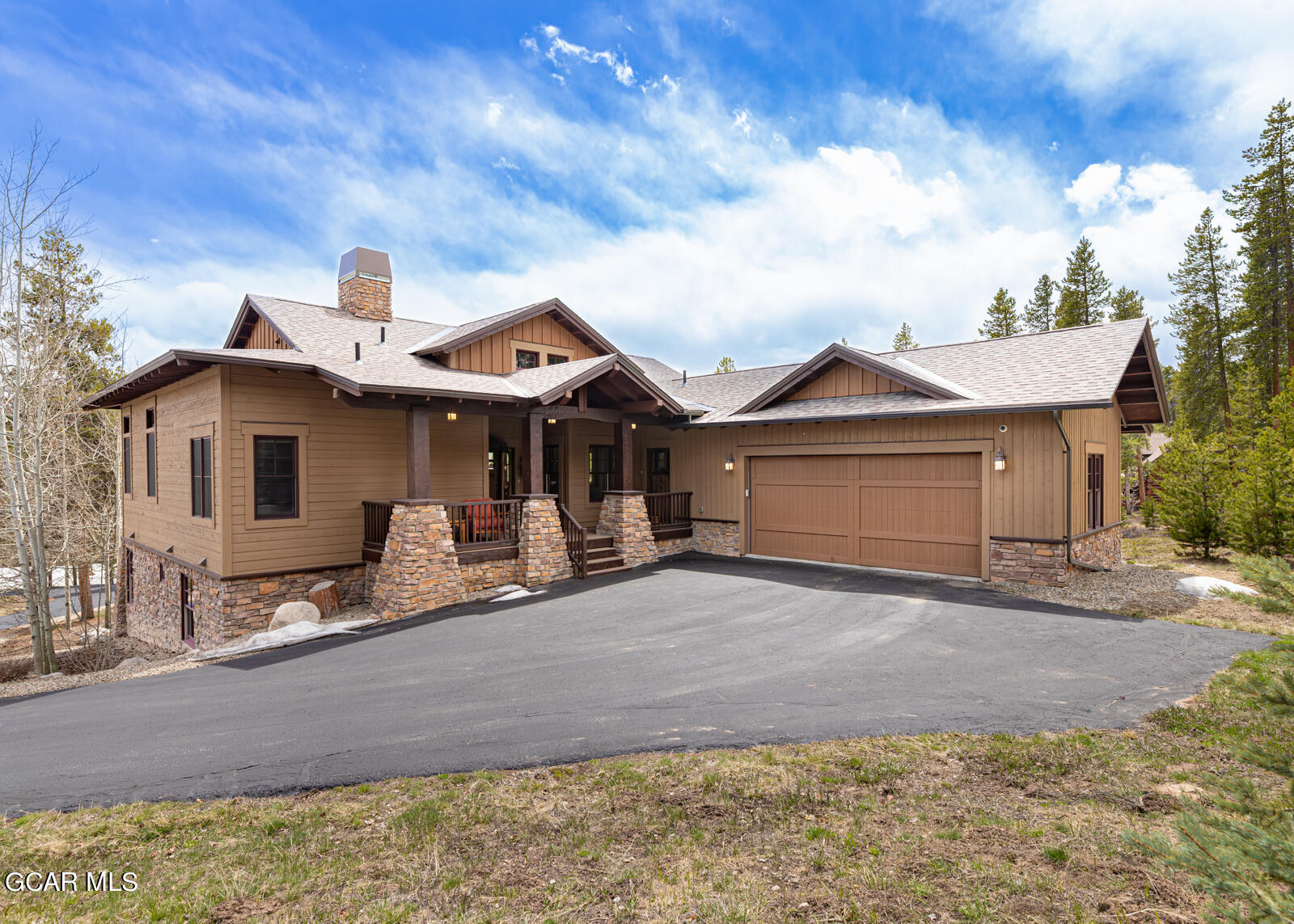 40 Golf Course Circle Tabernash, CO 80478 - Photo 2 of 57 a front view of a house with yard