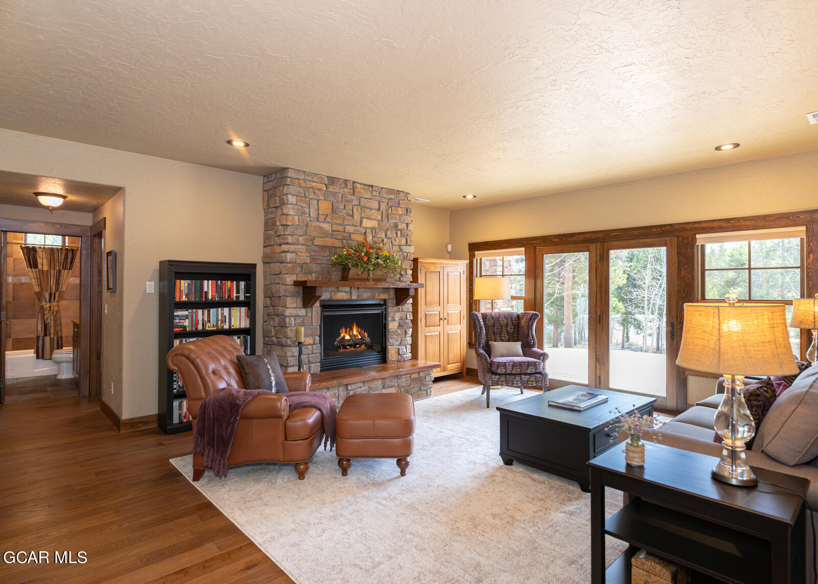 40 Golf Course Circle Tabernash, CO 80478 - Photo 24 of 57 a living room with furniture and a fireplace