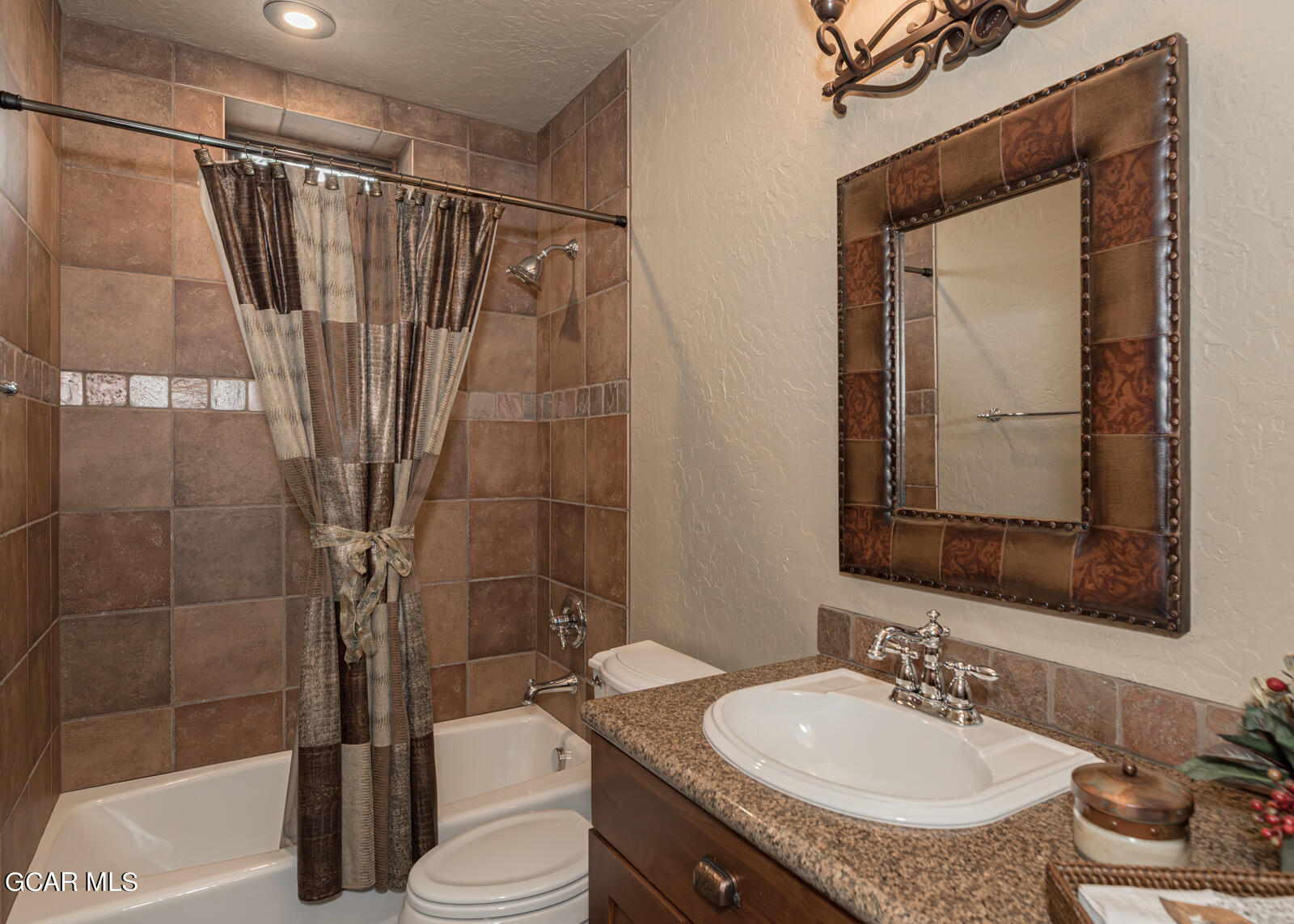 40 Golf Course Circle Tabernash, CO 80478 - Photo 29 of 57 a bathroom with a sink a toilet and shower