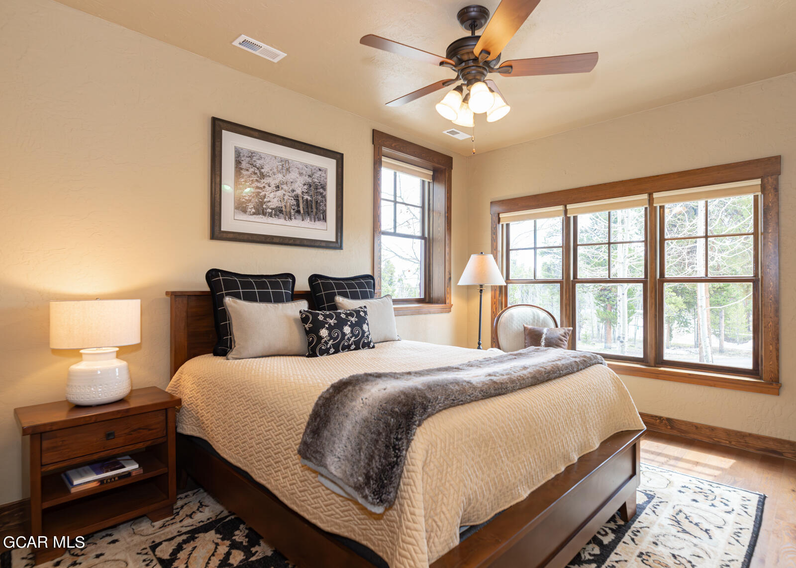 40 Golf Course Circle Tabernash, CO 80478 - Photo 30 of 57 a bedroom with a large bed and a window