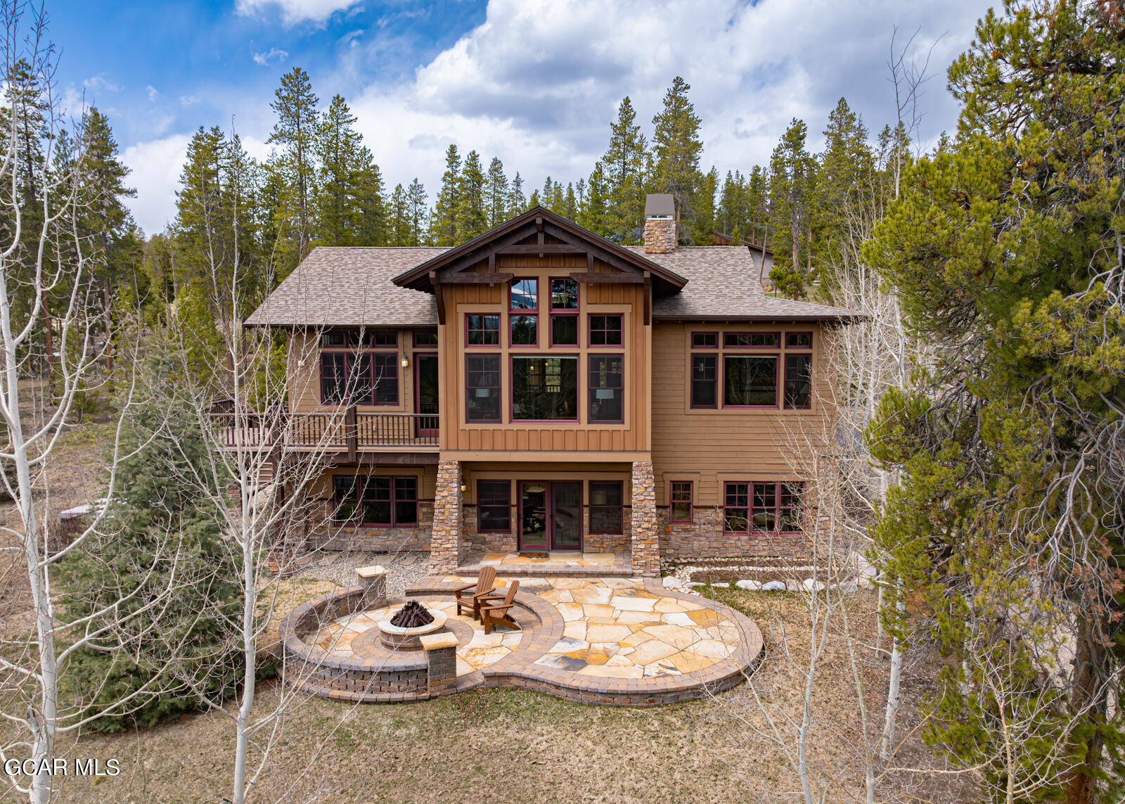 40 Golf Course Circle Tabernash, CO 80478 - Photo 3 of 57 a backyard of a house with table and chairs