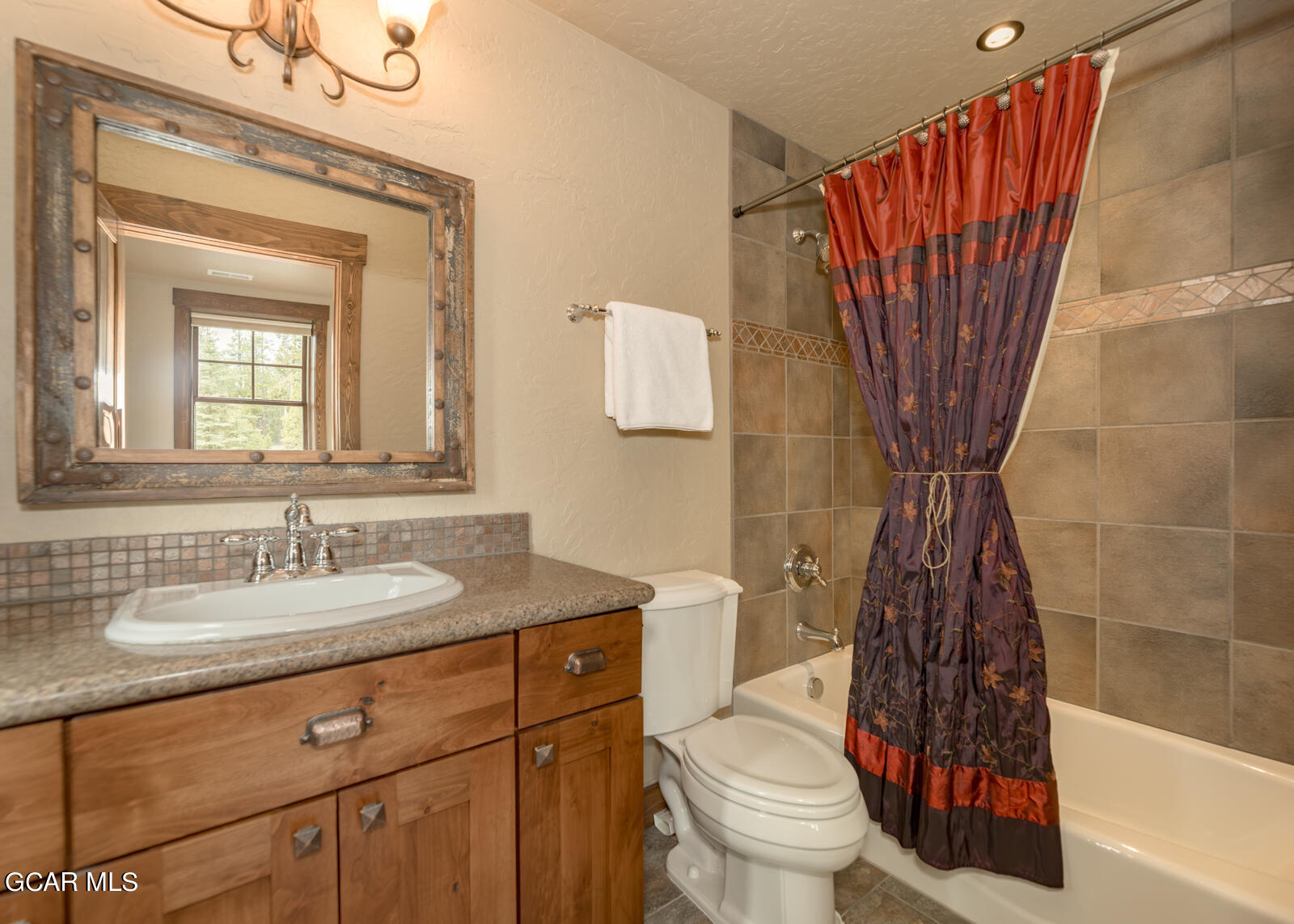 40 Golf Course Circle Tabernash, CO 80478 - Photo 31 of 57 a bathroom with a sink a toilet and shower