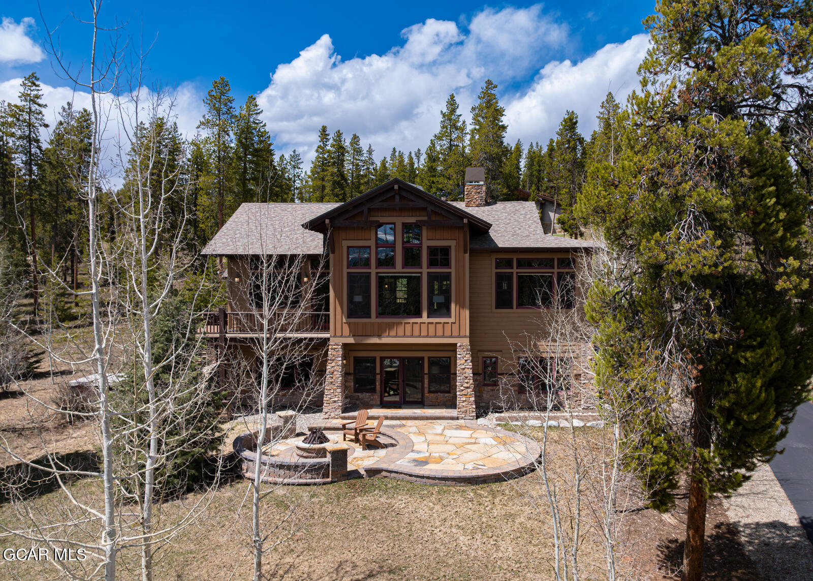 40 Golf Course Circle Tabernash, CO 80478 - Photo 54 of 57 a front view of a house with a garden and patio