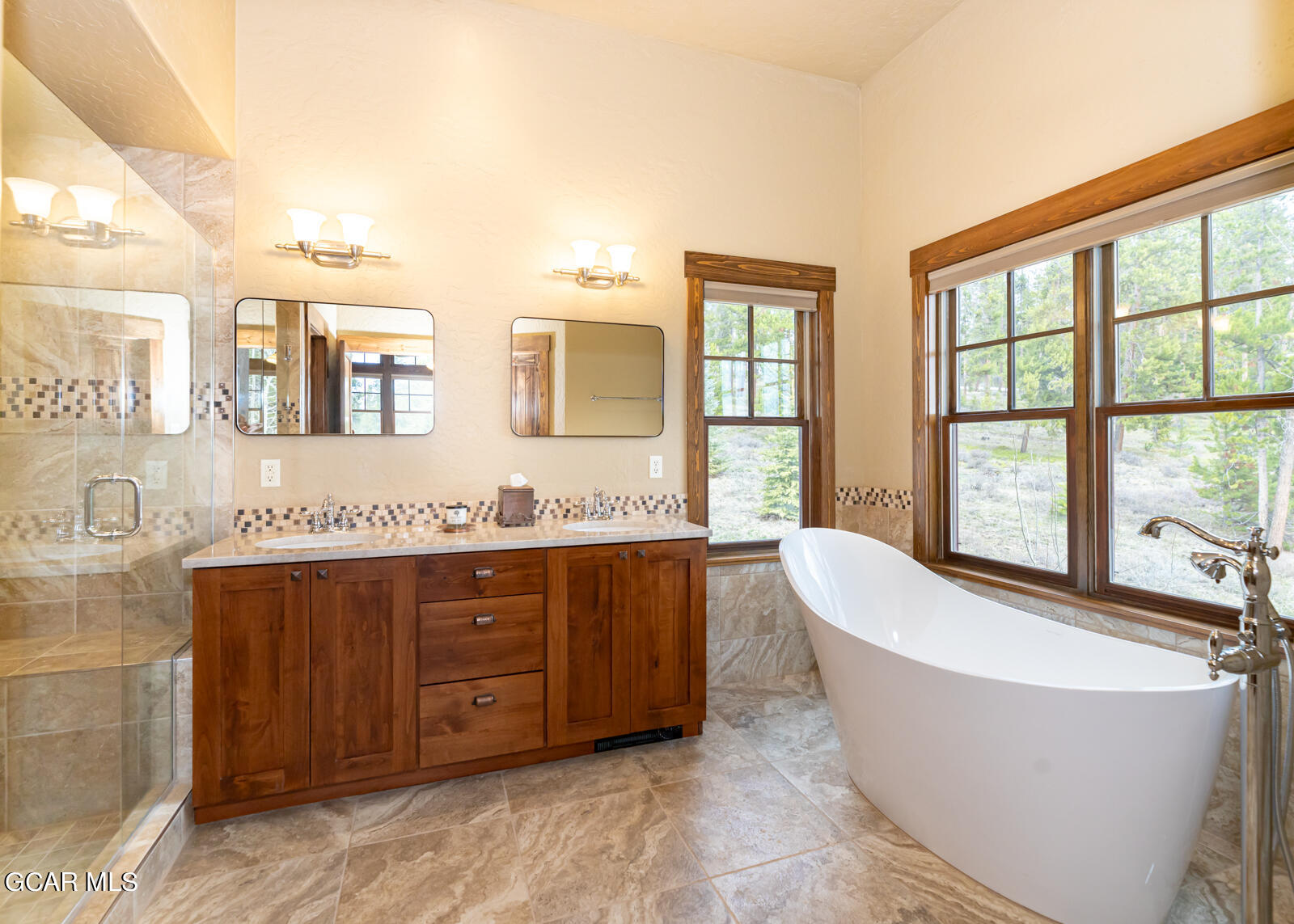 40 Golf Course Circle Tabernash, CO 80478 - Photo 10 of 57 a spacious bathroom with a tub sink and mirror
