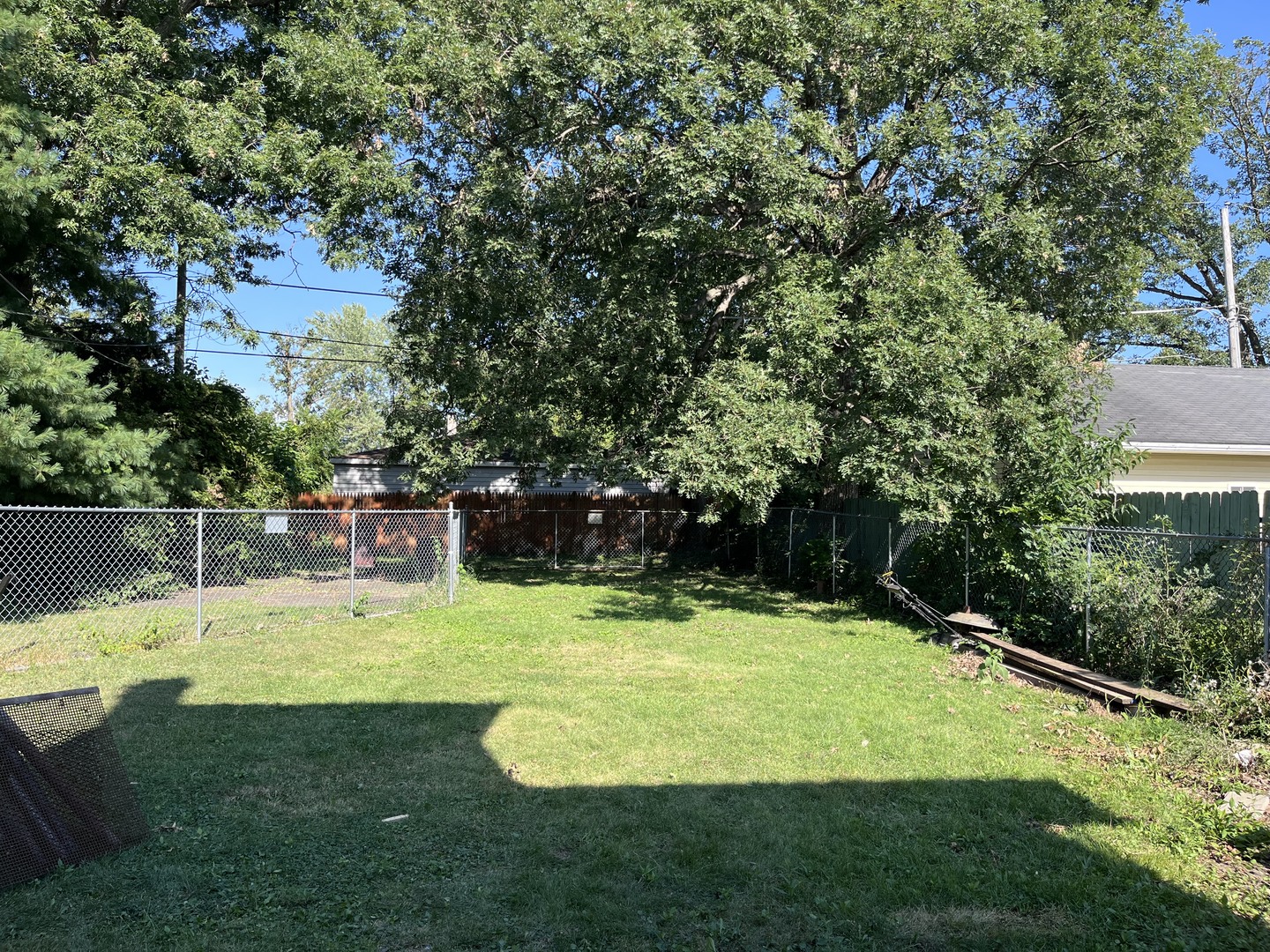 504 Scribner Street Joliet, IL 60432 - Photo 2 of 6 a view of a swimming pool with a yard