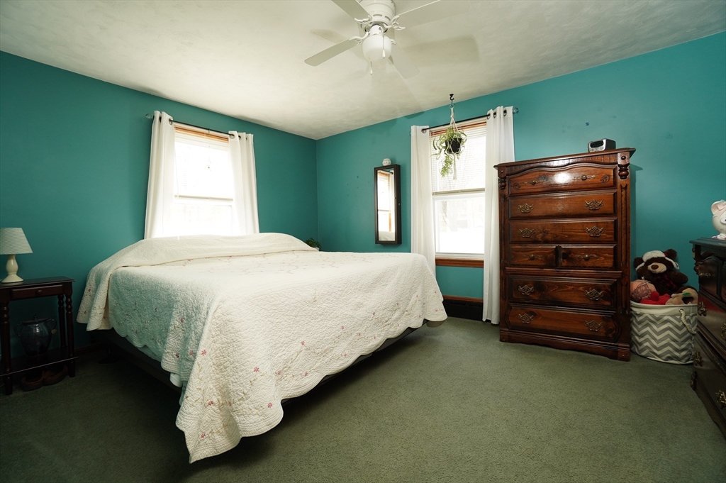 25 A Street Warren, MA 01092 - Photo 12 of 36 a bedroom with a bed and a window