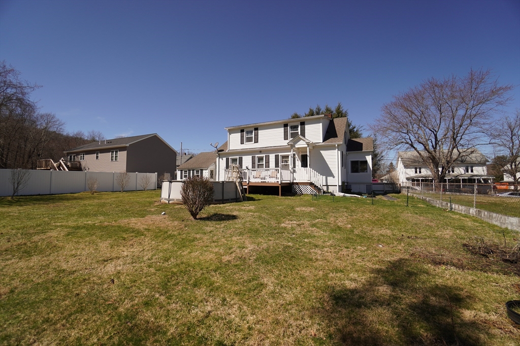 25 A Street Warren, MA 01092 - Photo 29 of 36 a front view of a house with a yard