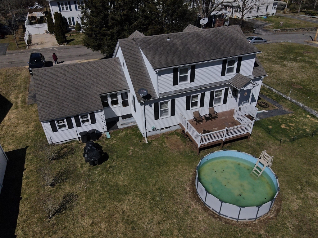 25 A Street Warren, MA 01092 - Photo 33 of 36 an aerial view of a house with backyard and trees