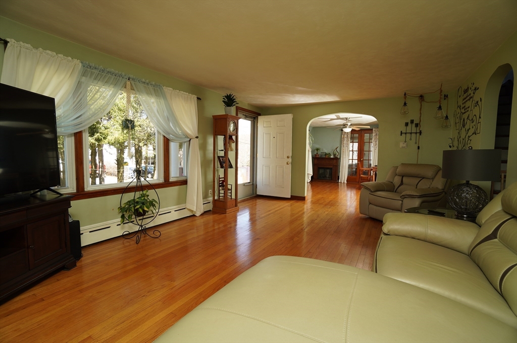 25 A Street Warren, MA 01092 - Photo 5 of 36 a living room with fireplace furniture and a flat screen tv