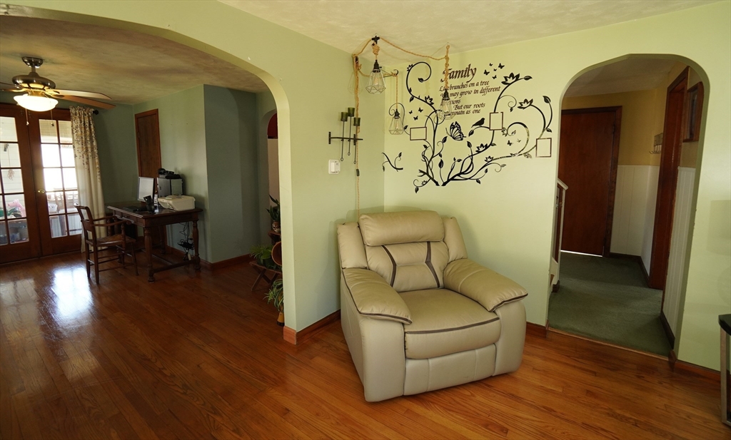 25 A Street Warren, MA 01092 - Photo 6 of 36 a living room with furniture and a wooden floor