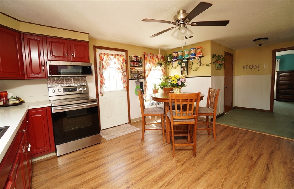 25 A Street Warren, MA 01092 - Photo 10 of 36 a view of a dining room with furniture window and wooden floor