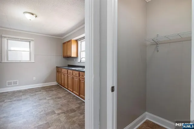 a white toilet sitting next to a bathroom sink