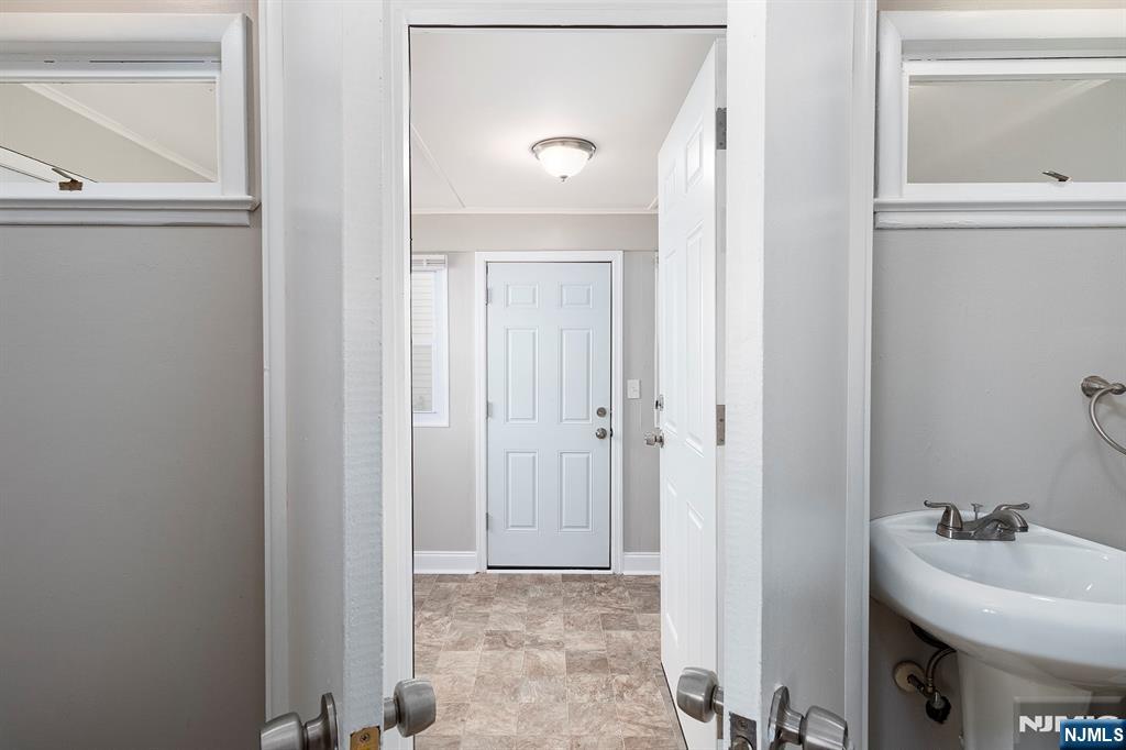 2557 Wh Mer Road Hamilton, NJ 08619 - Photo 14 of 36 a bathroom with a sink and a mirror