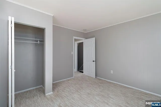 a bathroom with a sink a toilet a mirror and shower