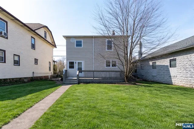 a view of a back yard of the house
