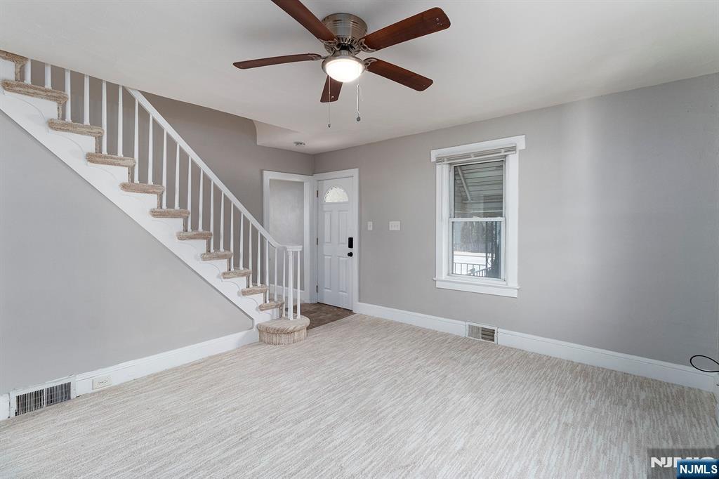 2557 Wh Mer Road Hamilton, NJ 08619 - Photo 4 of 36 a view of room with window ceiling fan and hardwood floor