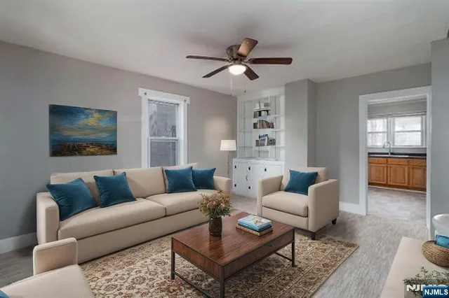 a living room with furniture and a window