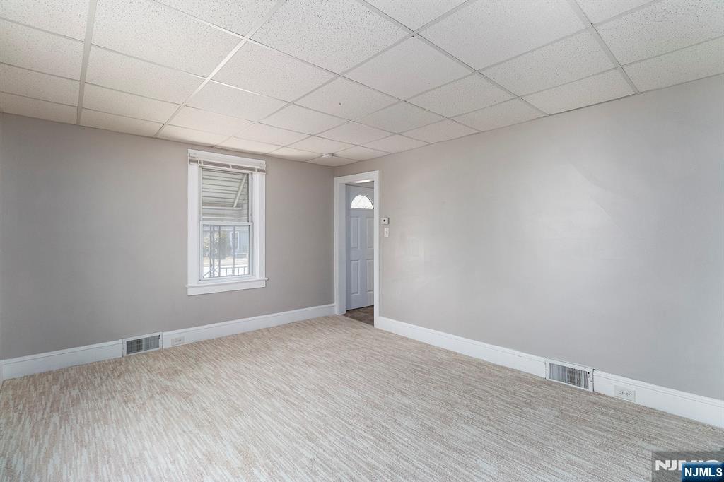 2557 Wh Mer Road Hamilton, NJ 08619 - Photo 7 of 36 an empty room with wooden floor and windows