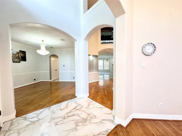a view of a bedroom from a hallway