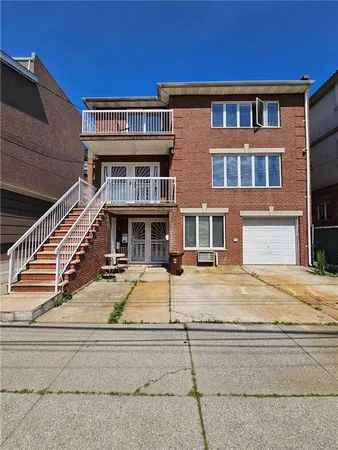 a view of a building with car parked