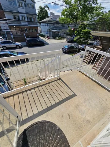 a view of balcony with furniture