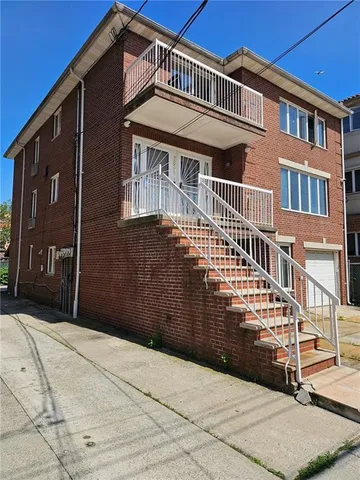a front view of a house with a garage