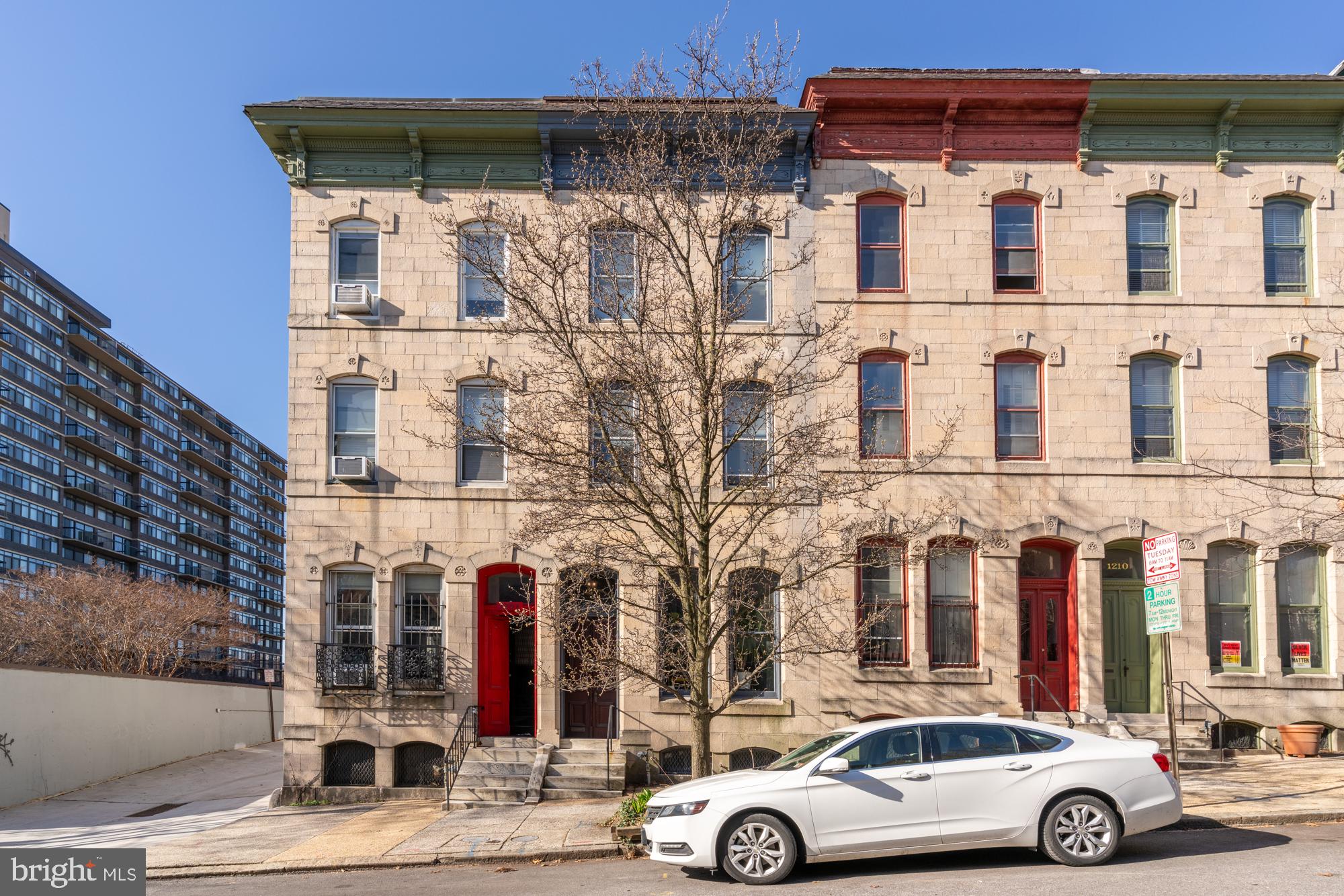 1206 John Street Baltimore, MD 21201 - Photo 2 of 53 front view of residential building with cars parked