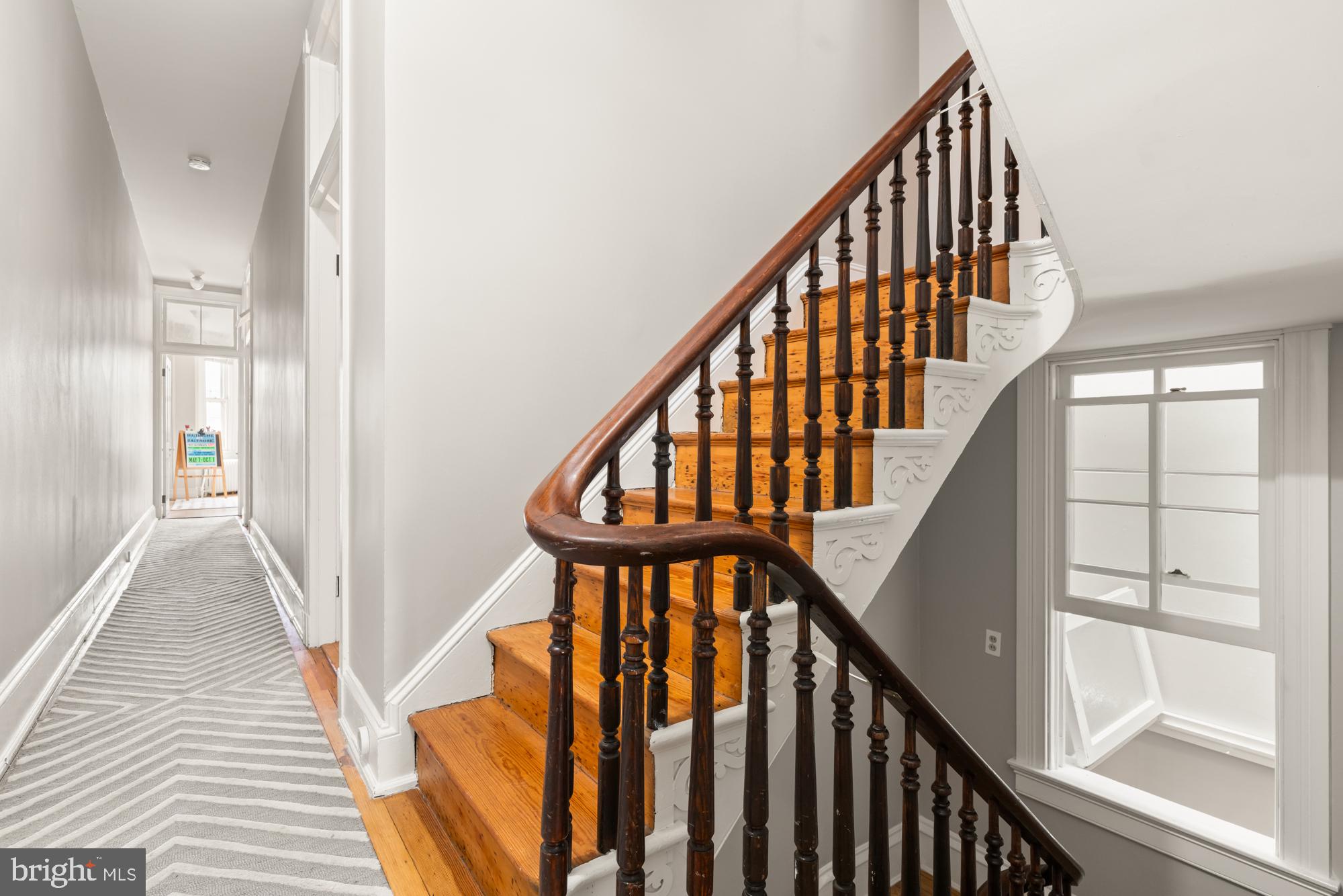 1206 John Street Baltimore, MD 21201 - Photo 22 of 53 a view of staircase with wooden floor and white walls