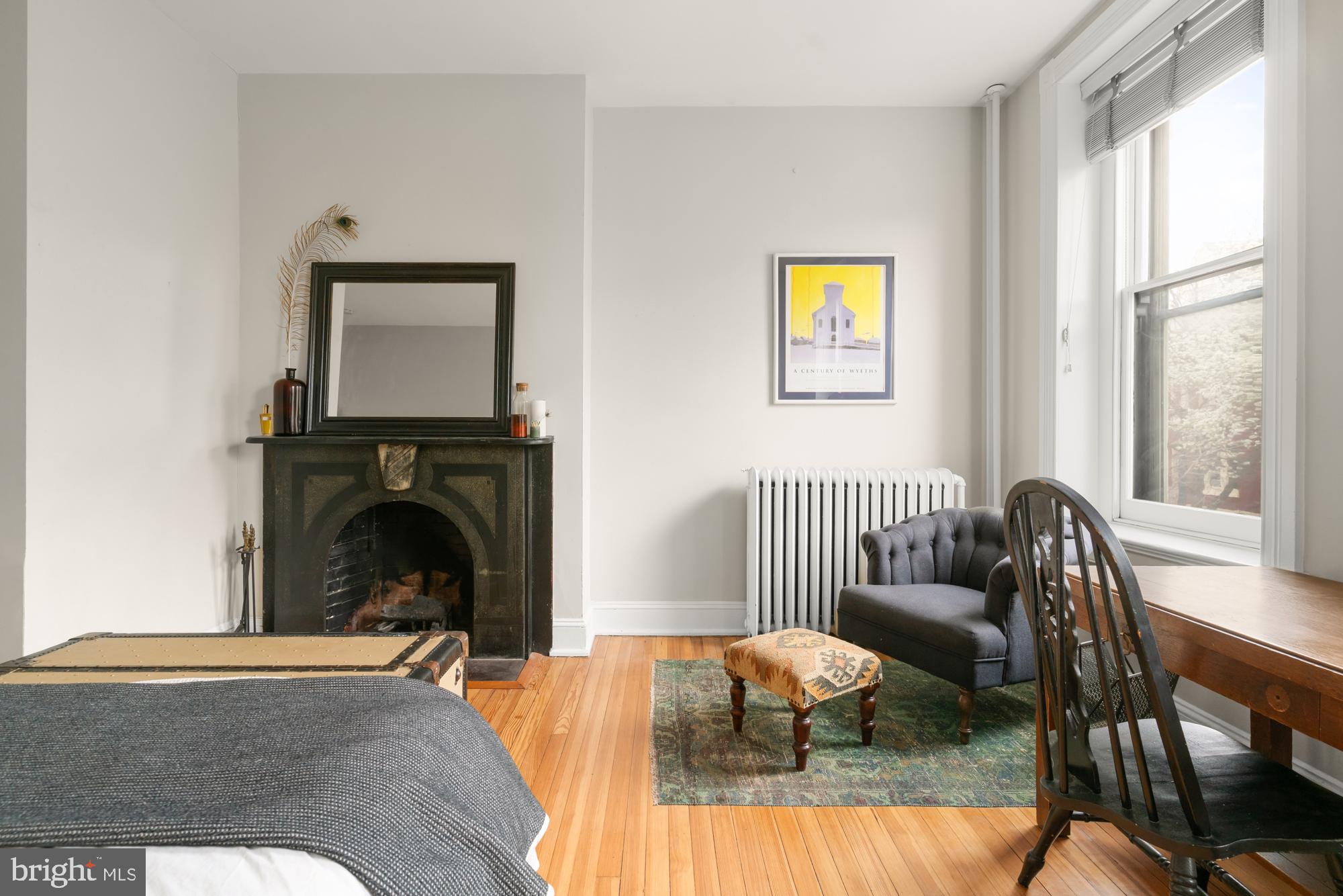 1206 John Street Baltimore, MD 21201 - Photo 26 of 53 a living room with furniture and a fireplace