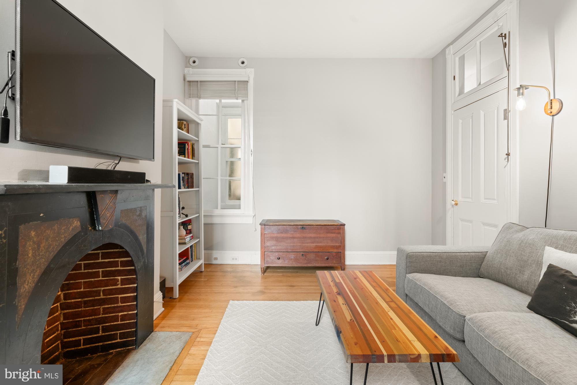 1206 John Street Baltimore, MD 21201 - Photo 29 of 53 a bedroom with furniture and a flat screen tv