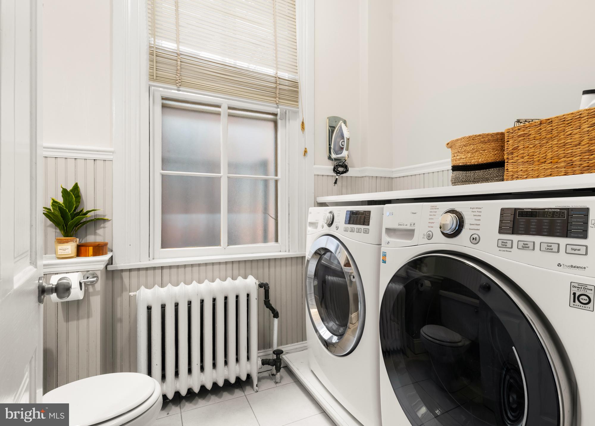 1206 John Street Baltimore, MD 21201 - Photo 30 of 53 a view of a bedroom with washer and dryer