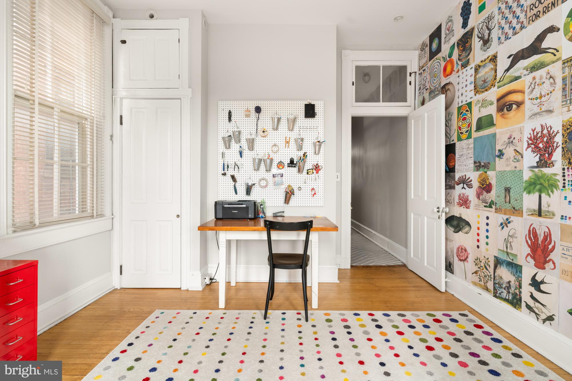 1206 John Street Baltimore, MD 21201 - Photo 34 of 53 a bedroom with a baby bed and a chair