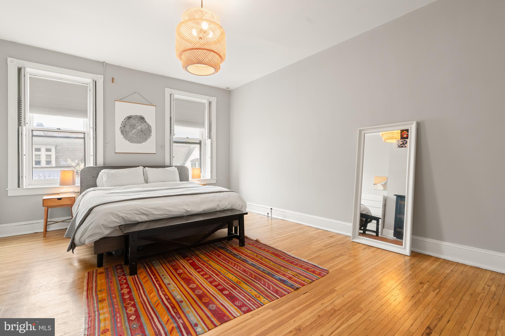 1206 John Street Baltimore, MD 21201 - Photo 37 of 53 a bedroom with a bed and wooden floor