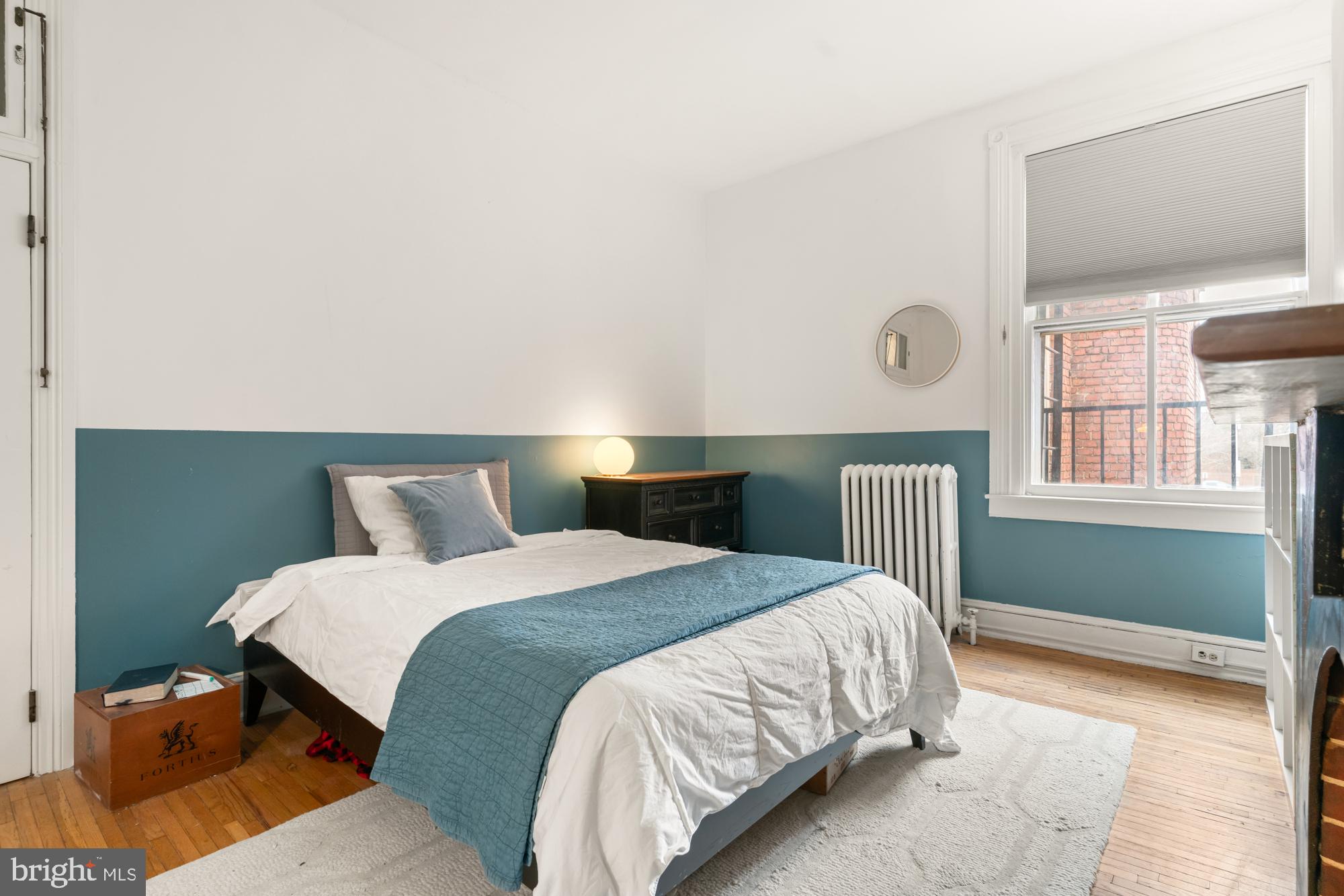 1206 John Street Baltimore, MD 21201 - Photo 40 of 53 a bedroom with a bed and window