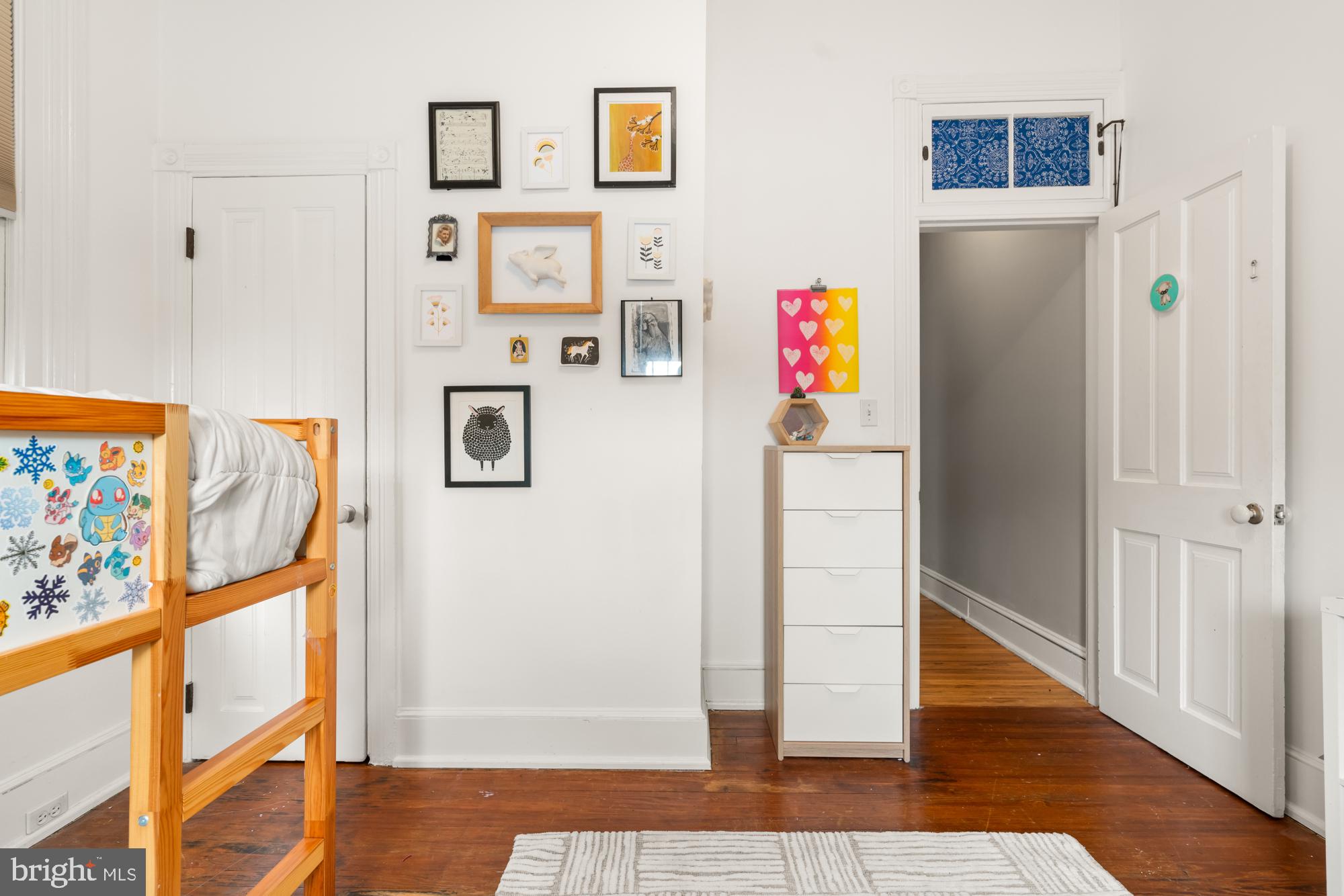 1206 John Street Baltimore, MD 21201 - Photo 45 of 53 a view of a hallway with wooden floor and dining room