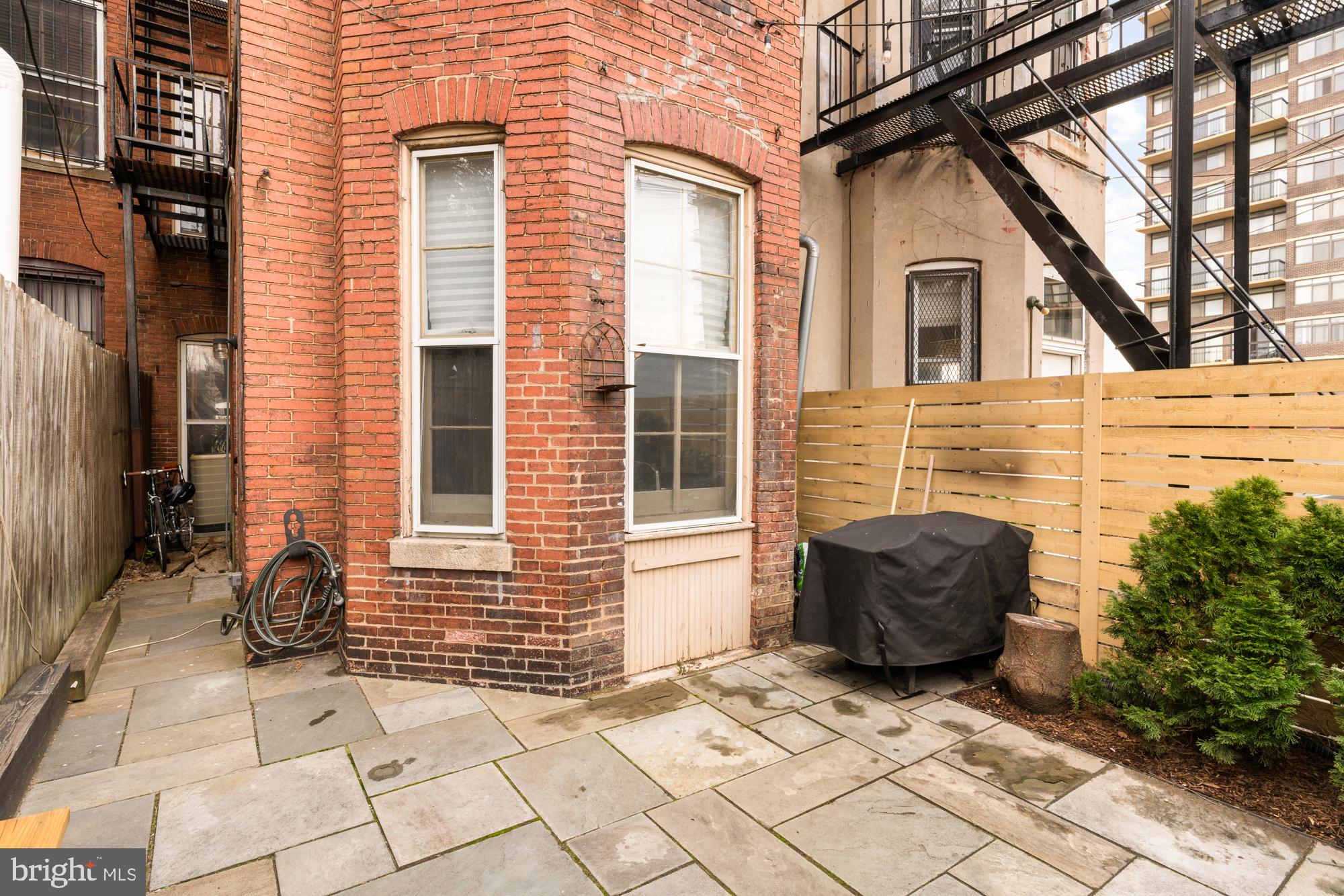 1206 John Street Baltimore, MD 21201 - Photo 47 of 53 a view of house with chair and wooden fence