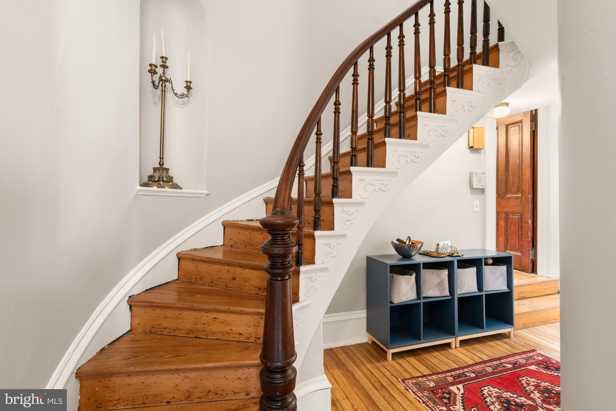 1206 John Street Baltimore, MD 21201 - Photo 9 of 53 a view of entryway with wooden floor and front door