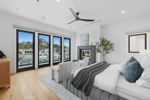 a bedroom with a large bed and a large window