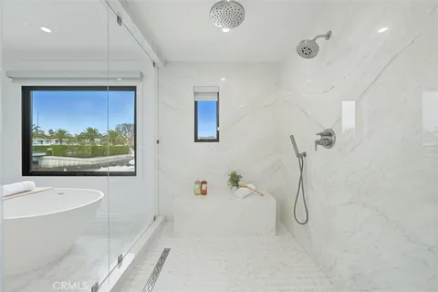 a bathroom with a bathtub and a shower