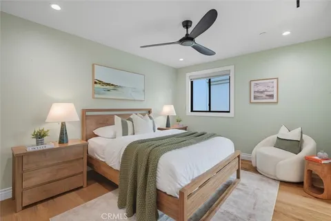a bedroom with a bed and a lamp