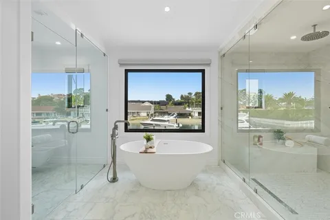 a bathroom with a bathtub and a shower