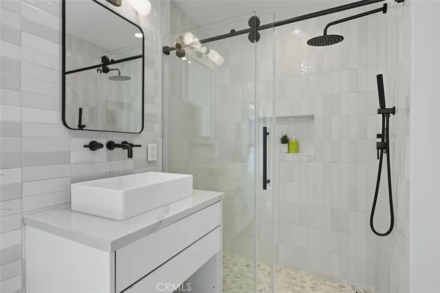 a bedroom with a bed and a lamp