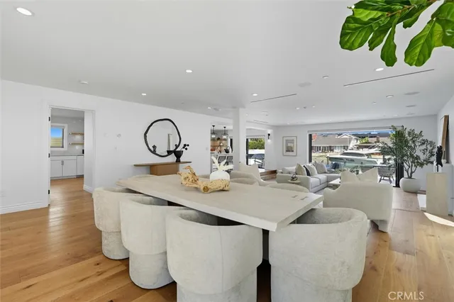 a living room with furniture a fireplace and a potted plant