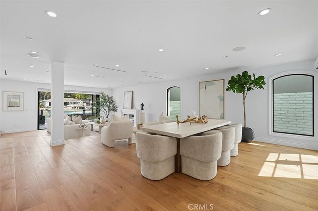 a bedroom with a large bed and a large window