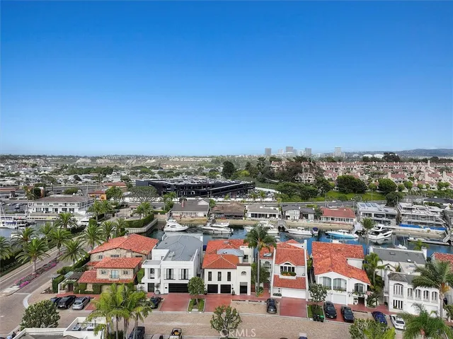an aerial view of a houses with yard