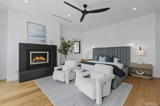 a bedroom with a bed and a lamp