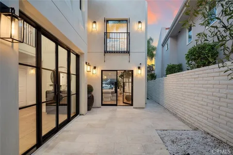 a view of a roof deck with couches and city view